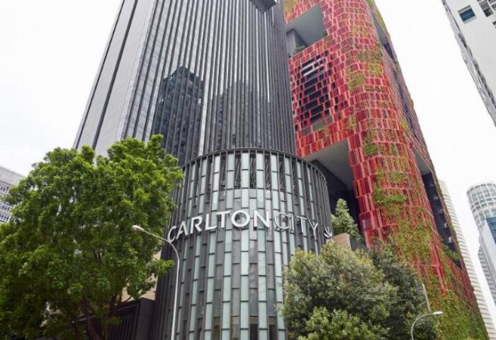 Carlton City Hotel Singapore exterior. Gay-friendly hotel with modern architecture and lush greenery. A great choice for gay travelers.