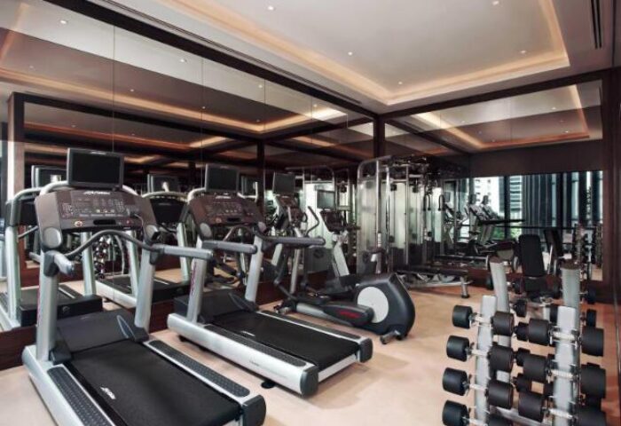Carlton City Hotel Singapore gym. Gay-friendly hotel fitness center with treadmills, weights, and other exercise equipment.