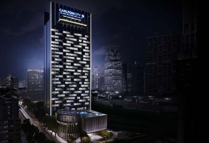 Carlton City Hotel Singapore at night. Gay-friendly hotel with modern architecture. A great choice for gay travelers in Singapore.