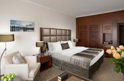 Carlton Tel Aviv Hotel luxury room. Gay-friendly hotel on the beach, featuring a king-size bed, modern decor, and a relaxing atmosphere.