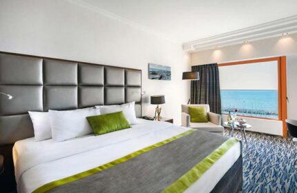 Carlton Tel Aviv Hotel room. Luxury gay-friendly hotel on the beach. Modern design, sea view. Perfect for gay travel.