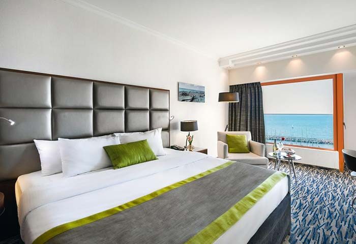 Carlton Tel Aviv Hotel room. Luxury gay-friendly hotel on the beach. Modern design, sea view. Perfect for gay travel.