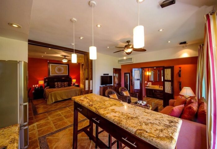 Casa Cupula, gay-friendly hotel suite. Open floorplan with bed, bath, kitchen bar, and living area. Upscale travel for gay men in Puerto Vallarta.