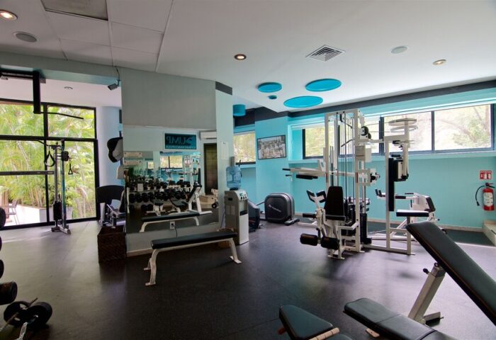 Casa Cupula's gay-friendly hotel gym. Fitness center with weights, machines, and mirrors. A great place for gay travelers to stay in shape.