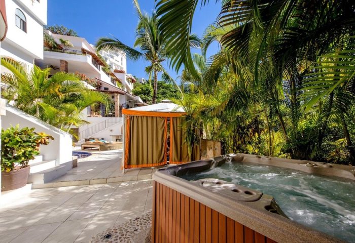 Casa Cupula, a gay-friendly hotel. Hot tub and cabana surrounded by lush greenery. Perfect for gay travel in Puerto Vallarta.