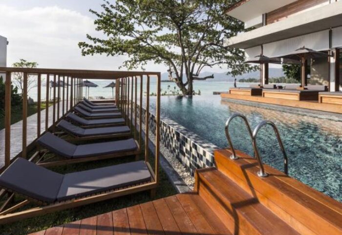 Casa De Mar Hotel's pool and lounge chairs. A gay-friendly hotel, perfect for gay men's travel. Relax by the pool with ocean views.