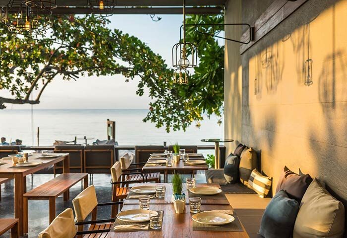 Casa De Mar Hotel's gay-friendly dining area. Tables are set, overlooking the ocean. A relaxing, inclusive atmosphere for gay travelers.