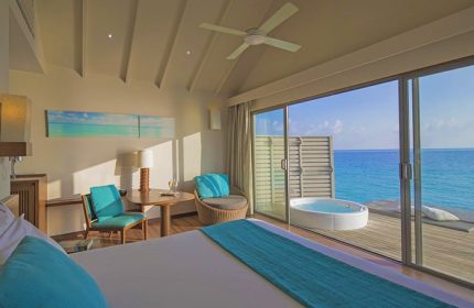 Centara Ras Fushi Resort & Spa Maldives gay-friendly hotel room. Ocean view, jacuzzi, deck. Ideal gay travel destination.