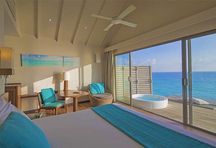 Centara Ras Fushi Resort & Spa Maldives gay-friendly hotel room. Ocean view, jacuzzi, deck. Ideal gay travel destination.