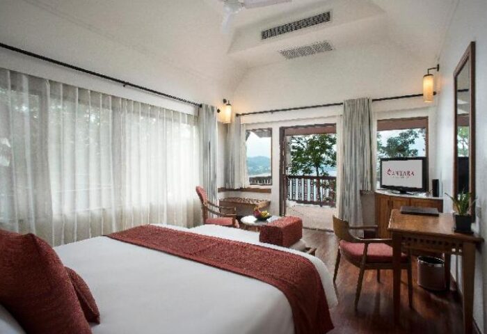 Centara Villas Phuket Hotel room. Gay-friendly hotel with balcony, bed, desk, & TV. Ideal for gay men's travel in Phuket.