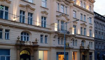 Hotel Century Old Town Prague MGallery facade. Gay-friendly, pet-friendly hotel in Prague's Old Town. Ornate architecture, cars parked outside.