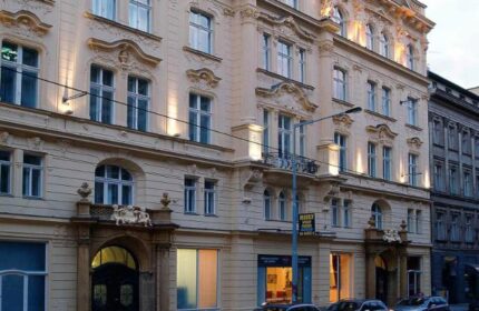 Hotel Century Old Town Prague MGallery facade. Gay-friendly, pet-friendly hotel in Prague's Old Town. Ornate architecture, cars parked outside.