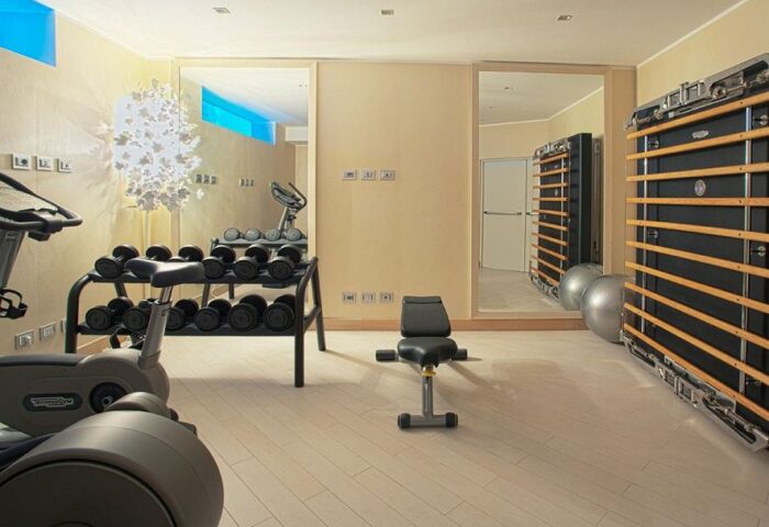 Chateau Monfort Hotel gym. Gay-friendly hotel fitness center with weights, exercise equipment, and wall bars. Luxury hotel for gay travelers.