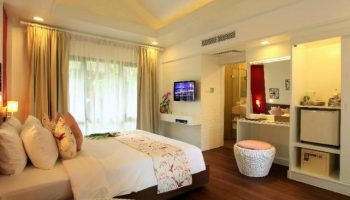 Chaweng Regent Beach Resort gay-friendly hotel room. Luxury bedroom with bed, TV, and bathroom. Ideal for gay men travel in Thailand.