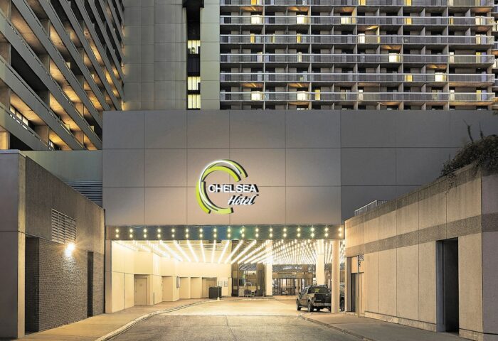 Chelsea Hotel Toronto entrance. This gay-friendly hotel offers a welcoming stay. The building's architecture is modern and inviting.