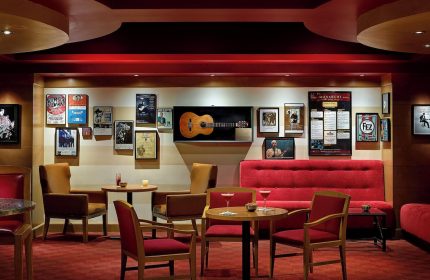 Chelsea Hotel Toronto's gay-friendly lounge area. It features cozy seating, warm lighting, and music-themed decor. Ideal for gay travelers.