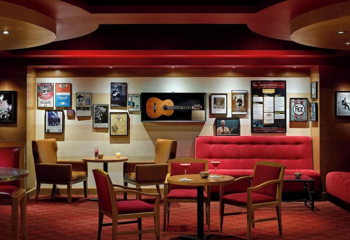 Chelsea Hotel Toronto's gay-friendly lounge area. It features cozy seating, warm lighting, and music-themed decor. Ideal for gay travelers.
