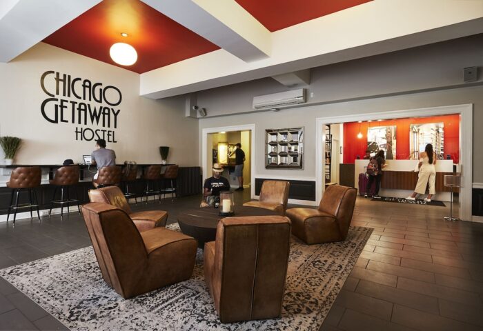 Chicago Getaway Hostel lobby. Gay-friendly hotel with lounge area, reception, and bar. Comfortable, stylish interior design. Great for gay travel.