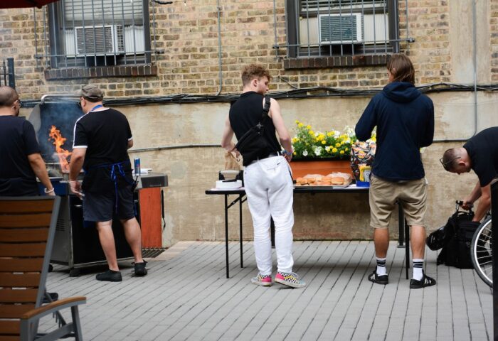 Chicago Getaway Hostel BBQ. Guests at this gay-friendly hotel enjoy an outdoor grill. A fun, social hostel experience.