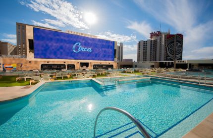 Circa Resort and Casino's Stadium Swim pool area. This gay-friendly, adults-only hotel in Las Vegas has a vibrant, fun atmosphere.