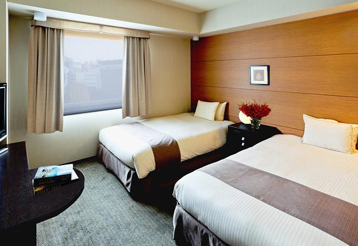 Citadines Central Shinjuku Tokyo room with two beds. Gay-friendly hotel in Shinjuku, Japan. Modern decor, comfortable for gay travelers.