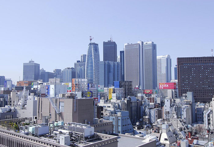 Shinjuku, Tokyo skyline view from Citadines Central, a gay-friendly hotel. Skyscrapers and buildings fill the cityscape.
