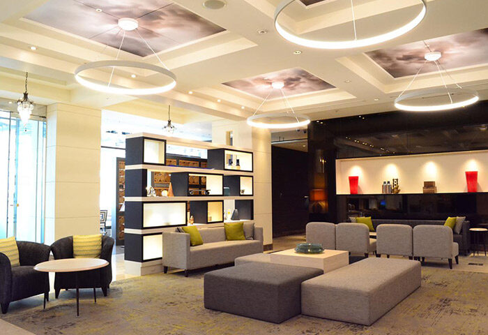 Citadines Central Shinjuku Tokyo lobby. Gay-friendly hotel with modern design, stylish seating, and unique lighting. A comfortable space for travelers.
