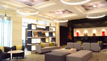 Citadines Central Shinjuku Tokyo lobby. Gay-friendly hotel with modern design, stylish seating, and unique lighting. A comfortable space for travelers.