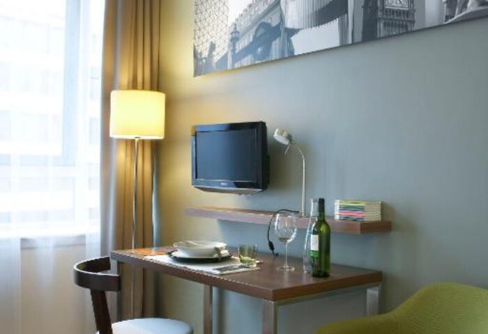 Citadines Holborn-Convent Garden London room interior. Desk, chair, & TV. Gay-friendly hotel in London, perfect for gay men travelers.