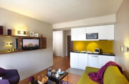 Citadines Les Halles Paris apartment interior. Gay-friendly, pet-friendly hotel with kitchen, TV, and modern design. Ideal for gay travelers.