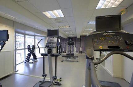 Citadines Les Halles Paris gym. Treadmills, elliptical trainers, and weights for a workout. Gay-friendly, pet-friendly hotel fitness center.