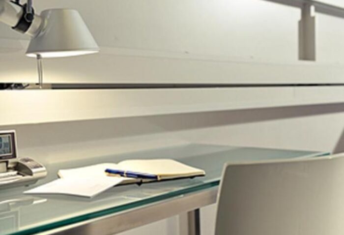 Desk in Citadines Shinjuku Hotel, a gay-friendly hotel. Workspace with lamp, notebook, pen, and chair. Ideal for gay travelers in Shinjuku, Tokyo.