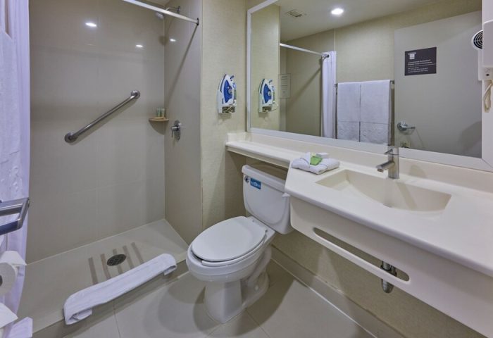 Bathroom at City Express Plus by Marriott Ciudad de México Reforma El Ángel, a gay-friendly hotel. Features a shower, toilet, and sink.