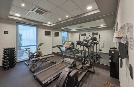 City Express Plus by Marriott Ciudad de Mexico Reforma El Angel gym. Treadmills, weights, and stationary bike. Gay-friendly hotel fitness center.