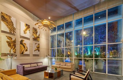 City Express Plus by Marriott Ciudad de México Reforma El Ángel lobby. Gay-friendly hotel interior with modern art and large windows.