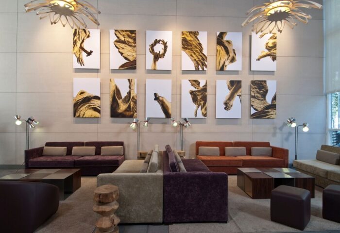 Lobby at City Express Plus by Marriott Ciudad de Mexico Reforma El Ángel, a gay-friendly hotel. Sofas, art, and lamps create a welcoming space.