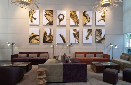 Lobby at City Express Plus by Marriott Ciudad de Mexico Reforma El Ángel, a gay-friendly hotel. Sofas, art, and lamps create a welcoming space.