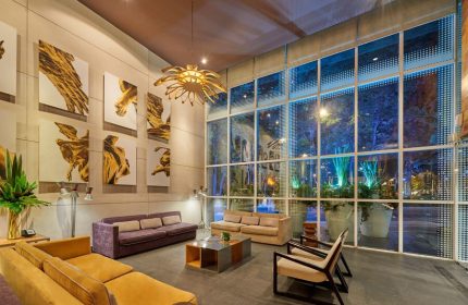 City Express Plus by Marriott Ciudad de Mexico Reforma El Angel lobby. Gay-friendly hotel with modern design, art, and comfortable seating.