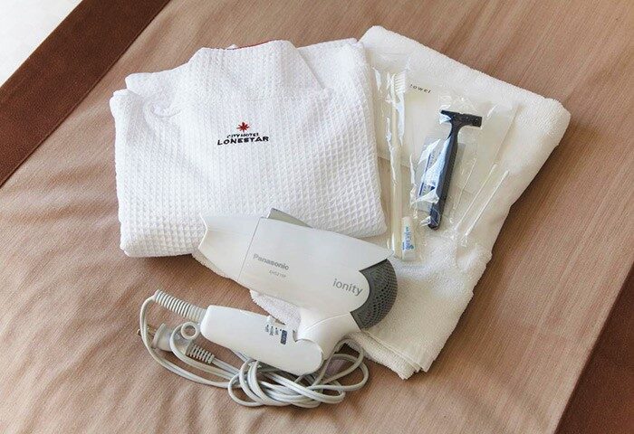 City Hotel Lonestar: Gay-friendly hotel room amenities. Bathrobe, towel, hair dryer, toothbrush, razor. Gay travel essentials.