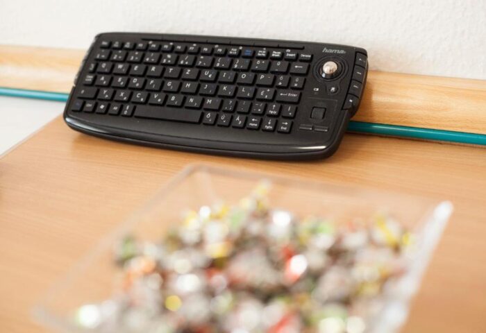 City Hotel Matyas's keyboard and candy dish. A gay-friendly hotel offering comfort and convenience for travelers. Enjoy the sweet treats!