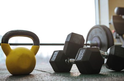 Gym at Gay-Friendly Hotel City Suites Chicago. Kettlebell, dumbbells, and weight machine for a great workout. Fitness for gay men travelers.
