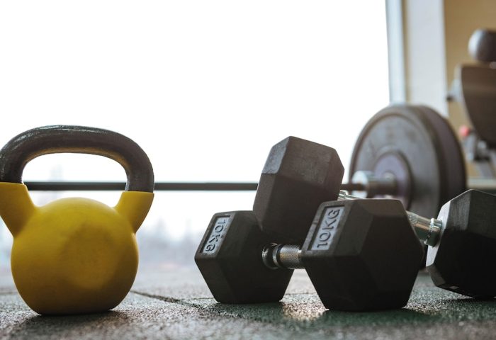 Gym at Gay-Friendly Hotel City Suites Chicago. Kettlebell, dumbbells, and weight machine for a great workout. Fitness for gay men travelers.