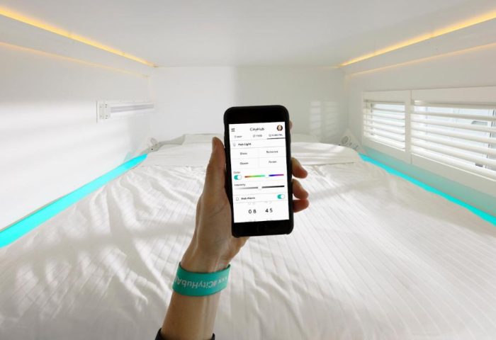 CityHub Amsterdam: Guest controls hub lighting with a phone app. A gay-friendly hotel with modern tech and customizable room ambiance.