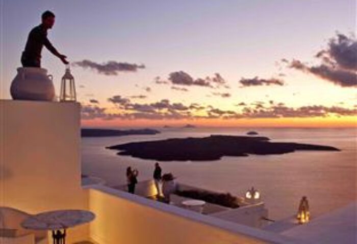 Cliff Side Suites gay-friendly hotel view. Sunset over the Aegean Sea from a suite's terrace. Romantic getaway for gay men.