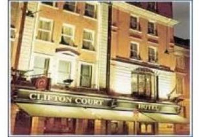 Clifton Court Hotel, a gay-friendly hotel. Building exterior with Clifton Court Hotel sign. Gay travel lodging option.