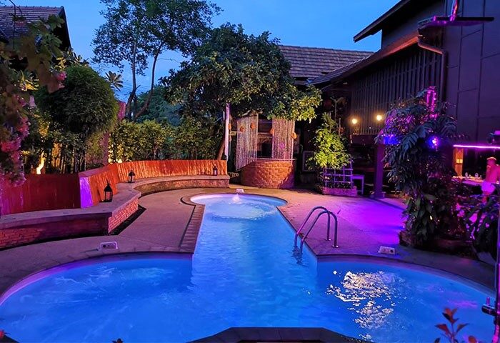 Club One Seven Gay Men Hotel in Chiang Mai: Pool area at dusk. Gay-friendly hotel with a relaxing atmosphere and stylish design.