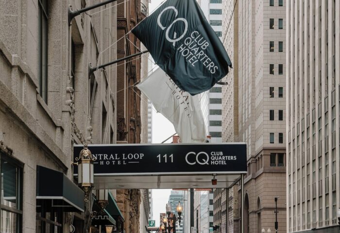 Club Quarters Hotel, Central Loop entrance. Gay-friendly hotel in Chicago's Central Loop. Flags and street view.