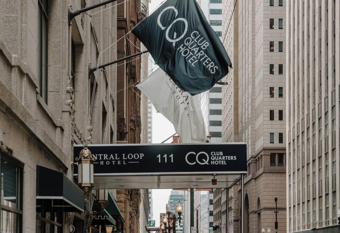 Club Quarters Hotel, Central Loop entrance. Gay-friendly hotel in Chicago's Central Loop. Flags and street view.