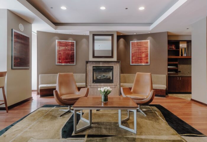 Club Quarters Hotel, Central Loop lobby. Gay-friendly hotel with fireplace, chairs, and modern decor. Chicago hotel for gay travelers.