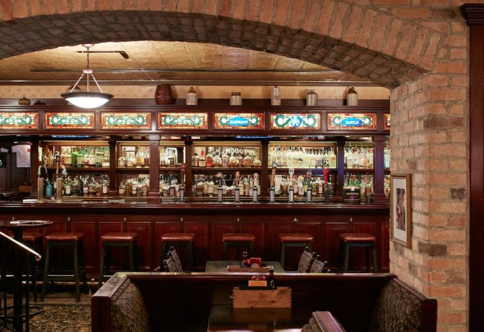 Club Quarters Hotel, Central Loop bar. Gay-friendly hotel with a fully stocked bar, stools, and booths. The bar has stained glass decor.